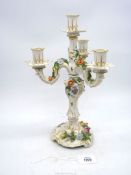 A Dresden four branch candelabra with leaf and floral design.