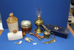 A stone glazed jar marked 'Pontypridd Herbal Brewery', brass oil lamp, resin owl handle,