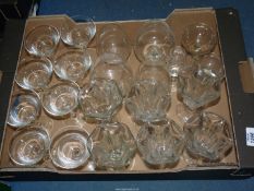 A quantity of clear glass including champagne bowls, ice cream sundae glasses,