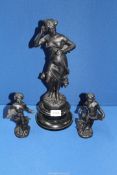 A pair of small cast metal figures, 7" tall and a cast metal lady figure, 16" tall.
