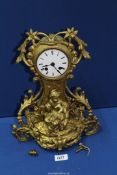 A heavy gold coloured finish metal cased Mantel Clock by ''Hry Marc a Paris'' having an enamelled