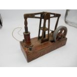 A fascinating electro-magnetically driven miniature Beam Engine mounted on an Oak base and having