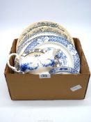 A quantity of blue and white china including plates, pin trays, sauce boat etc.