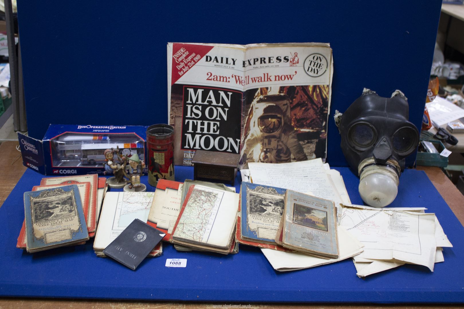 A quantity of miscellanea including gas mask, Ordnance Survey maps, boxed Corgi State Coach,