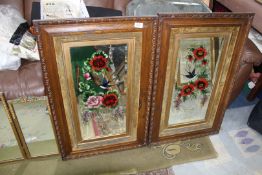 A pair of framed Mirrors, painted with colourful flower and an urn with swallows, 21'' x 33'' high.