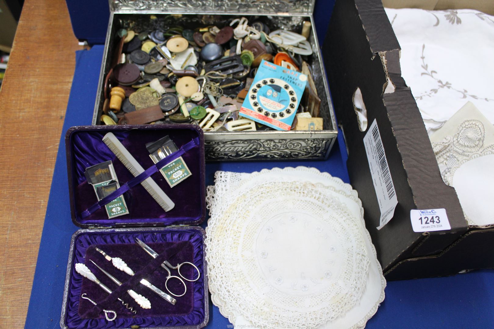 A quantity of embroidered linen, doilies, table cloths, box of buttons and buckles, etc. - Image 2 of 2