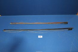 Two violin bows, both having paua shell, 29" and 25 3/4" long, a/f..