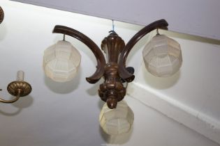 A 1930's wooden three branch ceiling light with frosted glass shades.