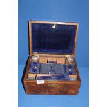 A Walnut vanity/writing Box, with blue velvet lined interior, two perfume bottles (one badly a/f),