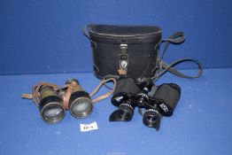 A cased pair of 8 x 30 Boots binoculars and a pair of John Browning metal and brass field