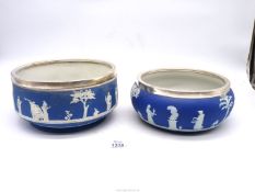 Two EPNS rimmed Jasperware dark blue Wedgwood bowls, 9" and 8" diameter.
