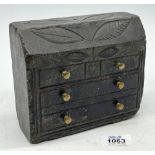 A Welsh slate Folk Art Doorstop in the form of a bureau, carved with leaves and a heart,