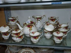 A Royal Albert 'Old Country Roses' tea service for twelve (one cup missing) including teapot,