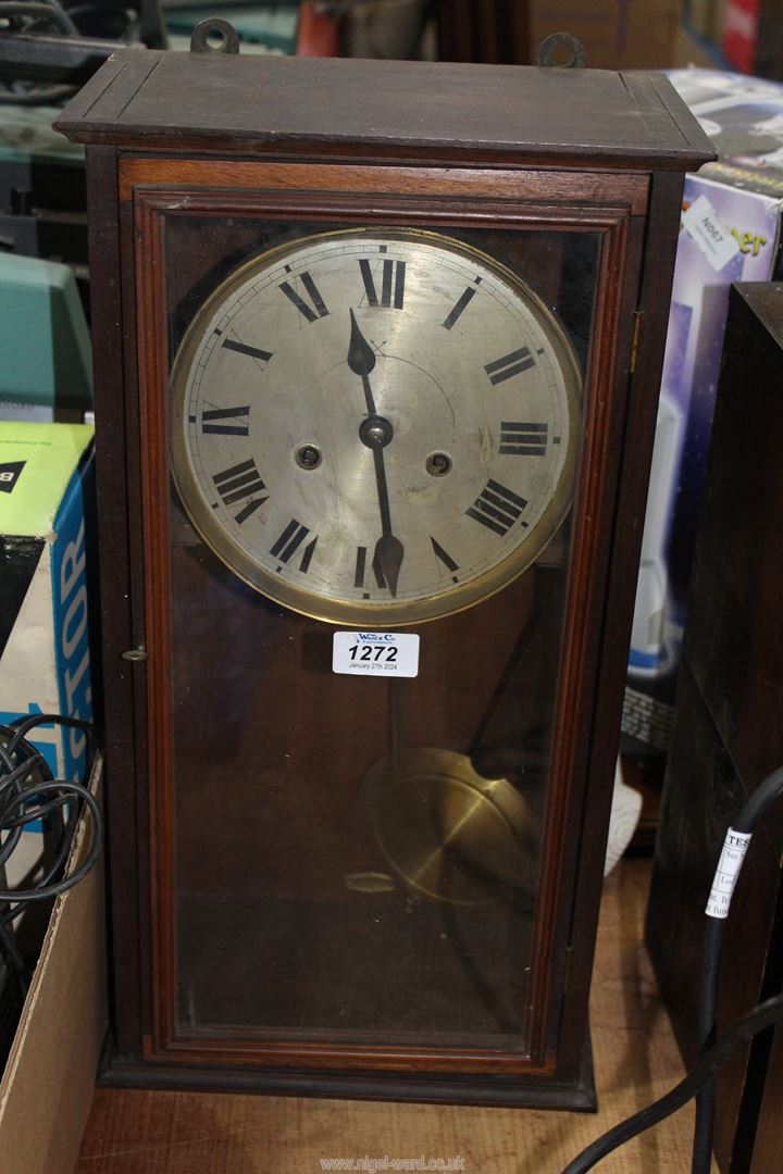 A cased train HAC X wall clock 19" x 6 1/2" x 9 3/4".