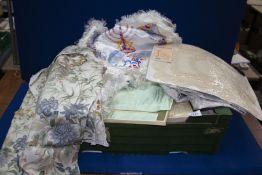 A box of vintage linen and Matzah covers.