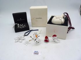 A small quantity of Swarovski ornaments to include; snowflake tree decoration, Disney 'Olaf',