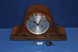 An Enfield wooden cased chiming mantle clock made for Dubros Stores with key and pendulum.
