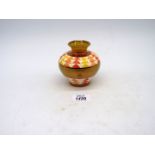 A Moorland Trial vase with gold lustre bands and red, orange and yellow triangle pattern, 4" tall.