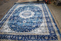 A Luxbury Collection border pattern carpet in dark blue and cream, 7'10'' x 10'6''.