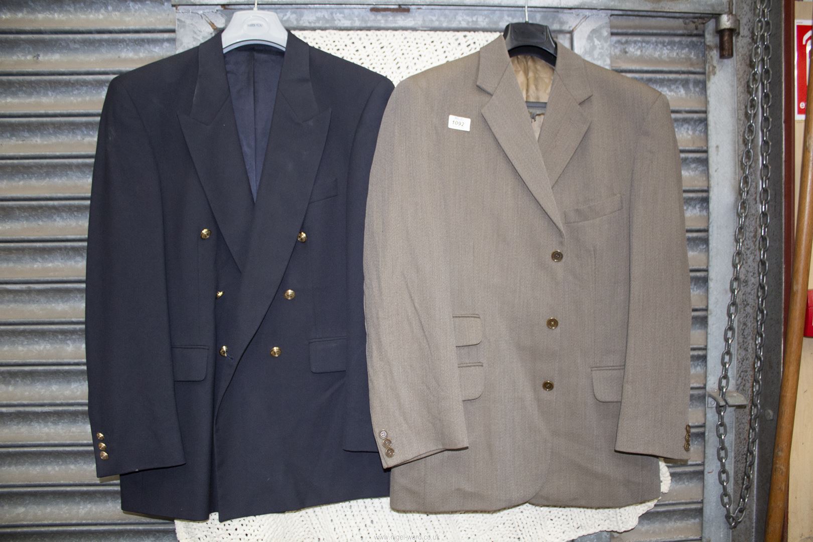 A Scott & Taylor gents navy blue, double breasted suit Jacket and a Jaeger gents pale brown,