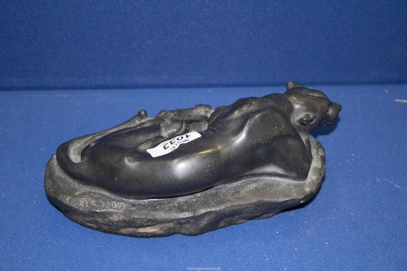 A black marble sculpture of a Puma lying on a rock, signed Masson, 9" long. - Image 2 of 4