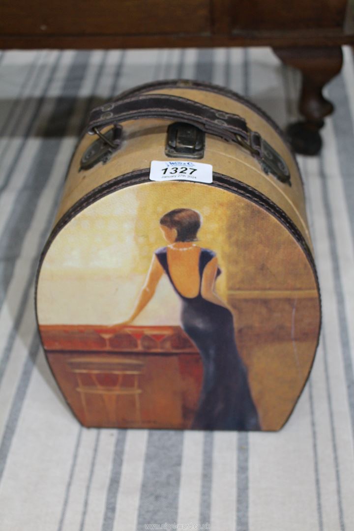 A small horseshoe shaped case with illustrations of a lady of fashion at a cocktail bar,