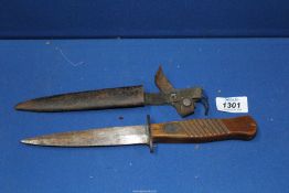 A WWI German trench knife and sheath, blade in rust worn condition.