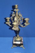 A four branch Candelabra having centre holder (part of a set) on a square base with paw feet 16