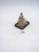 A small Dresden figure of a Crinoline lady, some lace missing, 3 1/2" tall.