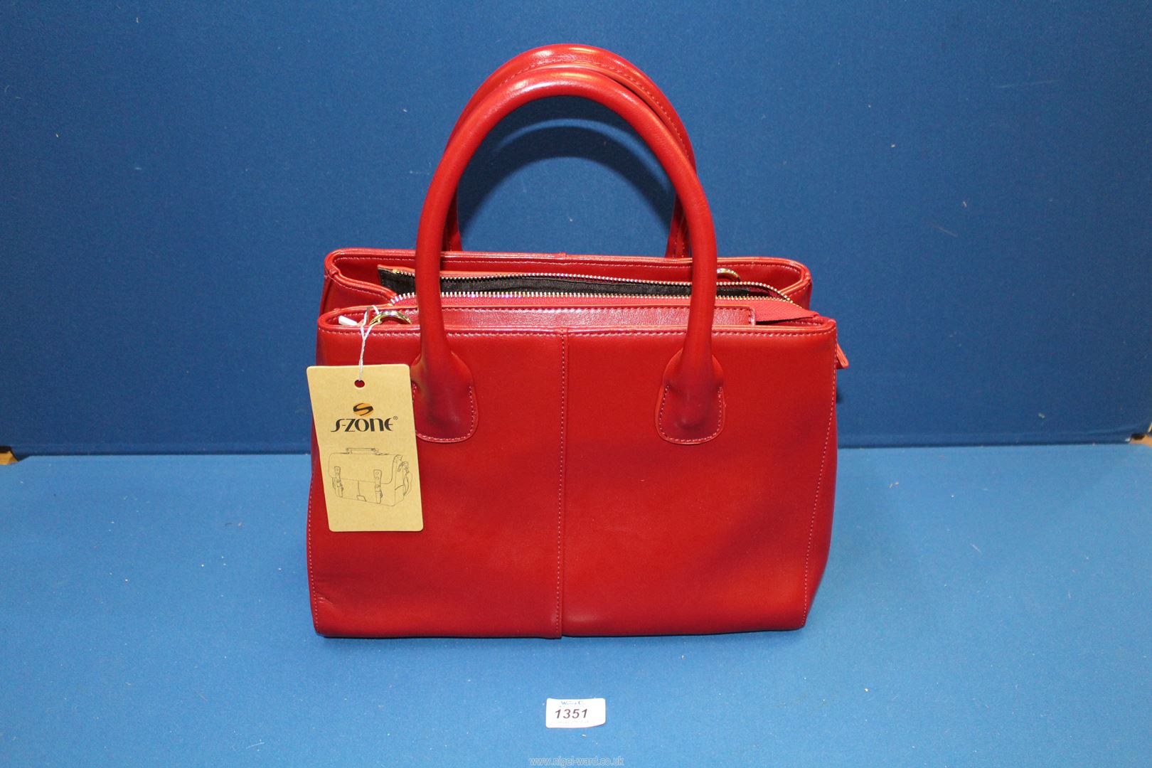 A designer S - Zone red leather ladies handbag, as new with tags.