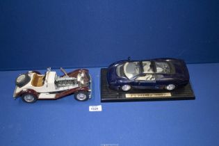 A Maisto scale model jaguar XJ220 1992 model and a Burago vintage Mercedes Benz SSK SSKL (a/f).