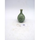 A Celadon vase with bird and floral detail, 5" tall.