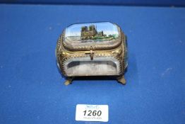 A French ormolu gilt and glass jewellery souvenir casket having scene of Notre Dame Cathedral to