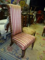 A circa 1900 Mahogany/Walnut framed Nursing Chair having twist backrest side supports and standing