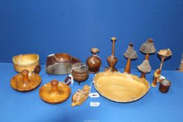 A box of treen to include; a witches cauldron lidded salt pot, carved walnut badger cub,