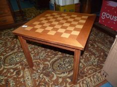 A mixed woods chequer board top Chess/draughts Table, 21'' x 21'' x 17'' high.