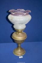 A copper oil Lamp with pink edged glass shade, 19 1/2'' tall, a/f.