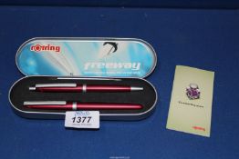 A Rotring fountain pen and a ballpoint pen set in a tin case.