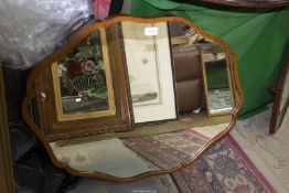 A large mirror (from a dressing table) with wavy edged walnut veneer frame, 33" x 24".