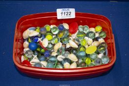 A quantity of glass marbles, shells and counters.