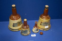 Four 'Bells Scotch Whisky' decanters, corks a/f.