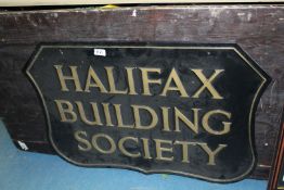 A black and gold painted cast metal shield shaped 'Halifax Building Society' Sign,