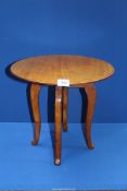 A circular Mahogany occasional Table standing on cabriole legs, 16 5/8'' diameter x 15 3/8'' high.
