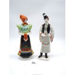 Two Hollohaza porcelain figures of a lady and gent in traditional dress.