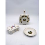 Three pieces of Hollohaza china including souvenir decanter and plate and a lidded box with floral