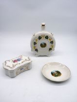 Three pieces of Hollohaza china including souvenir decanter and plate and a lidded box with floral