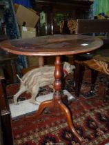An oval snap-top occasional Table having cross-banding and central shaded marquetry oval feature