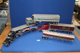 Three large scale Franklin Mint precision models of American Trucks and Trailers including;