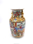 A large Chinese Cantonese vase having hand painted figures and warriors on horseback with gilt dogs
