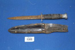 Commando knife with leather sheath, rust worn blade.